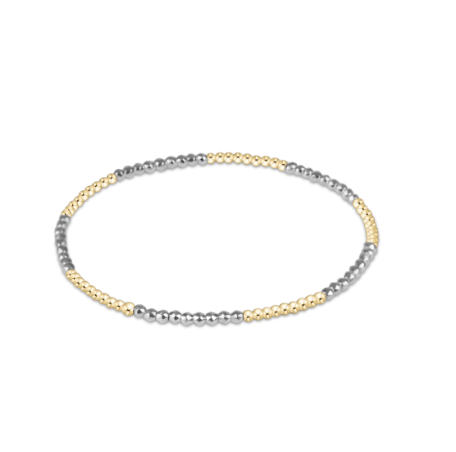 silver pyrite and gold alternating beaded bracelet on a white background