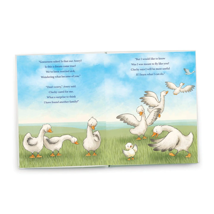 Baby reading Avery the Aviator book by Bunnies by the Bay, featuring colorful illustrations and a cute aviator-themed cover.