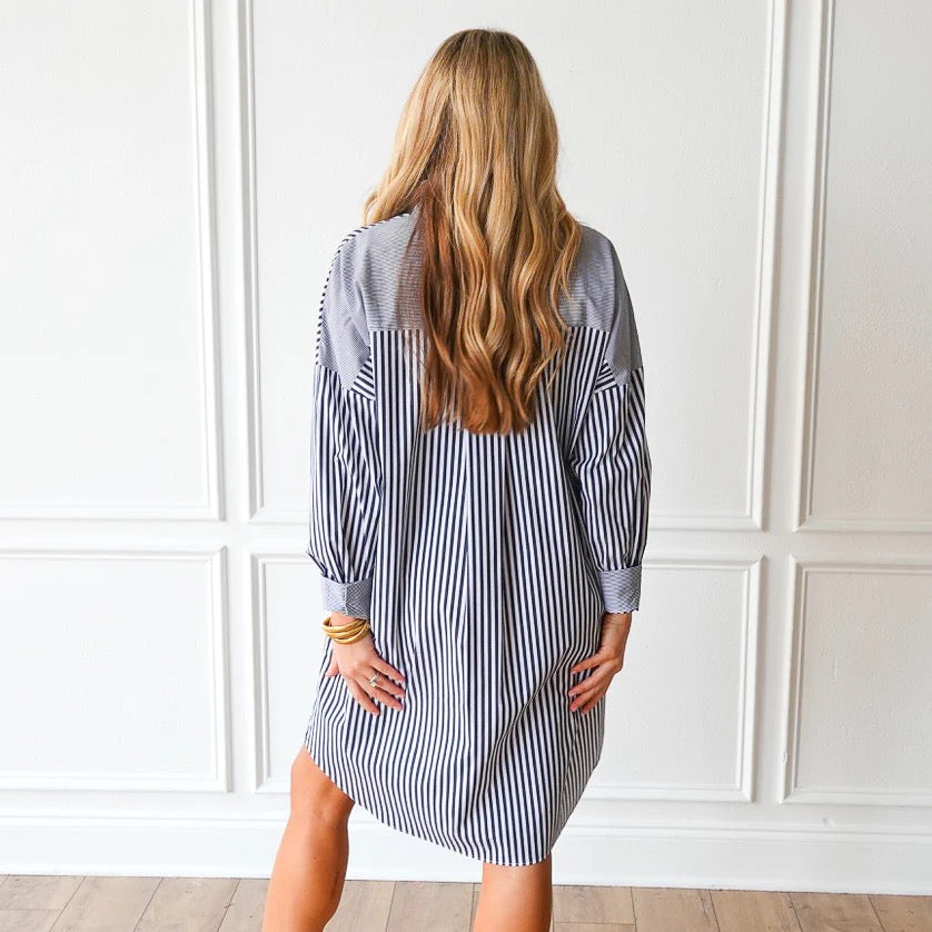 Charcoal striped Francis dress by Caryn Lawn featuring a stylish, fitted design and elegant length, perfect for casual or formal wear.