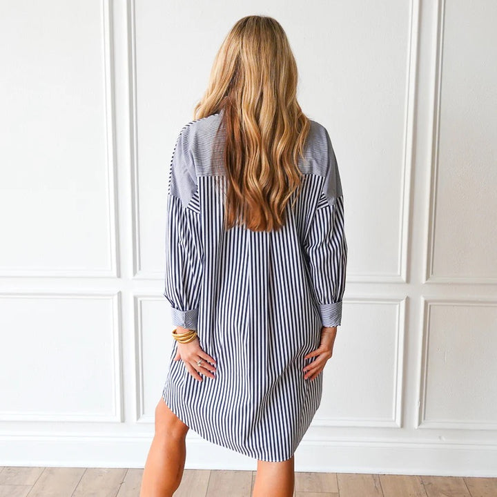 Charcoal striped Francis dress by Caryn Lawn featuring a stylish, fitted design and elegant length, perfect for casual or formal wear.