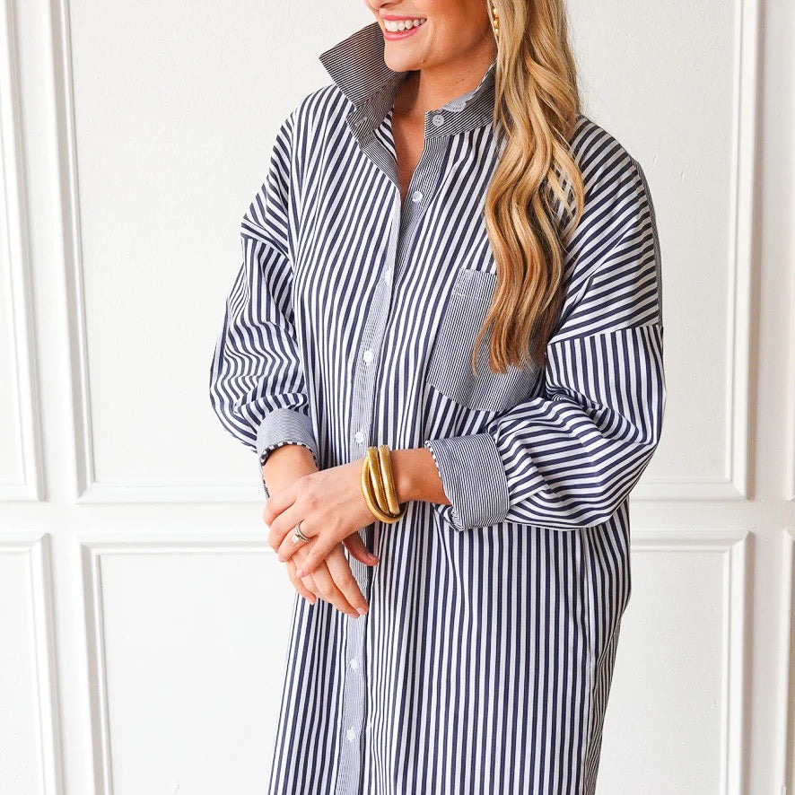 Caryn Lawn Francis Dress in charcoal with white stripe pattern, stylish women's dress showing a fitted silhouette and elegant design.