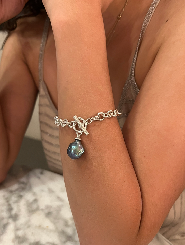 Catherine Canino Baroque and silver links bracelet with intricate detailing, styled as a stylish accessory.