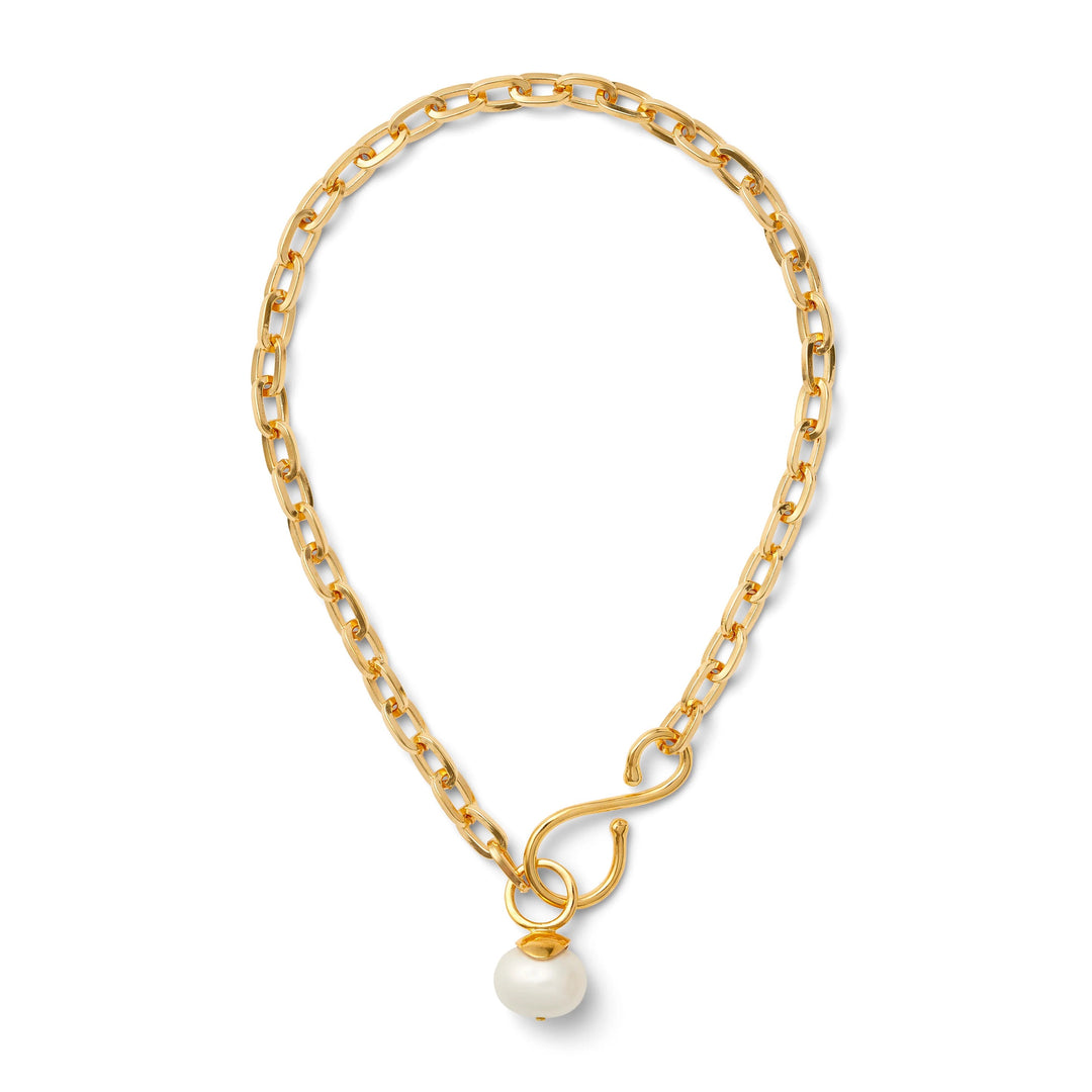 Big and bold gold pearl pendant necklace by Catherine Canino, featuring a striking gold chain and a large pearl pendant.