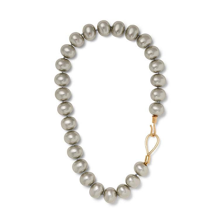 Slate grey lasso pebble accessory by Catherine Canino, featuring smooth, rounded stone with a lasso-style design.
