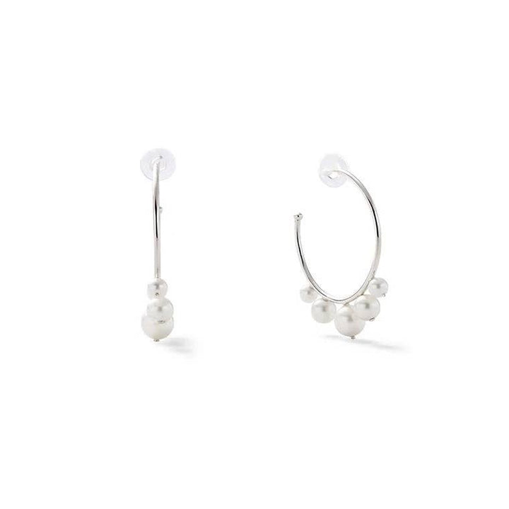 Small pearl swirl earrings by Catherine Canino, delicate jewelry accessories featuring elegant pearl and swirl design.