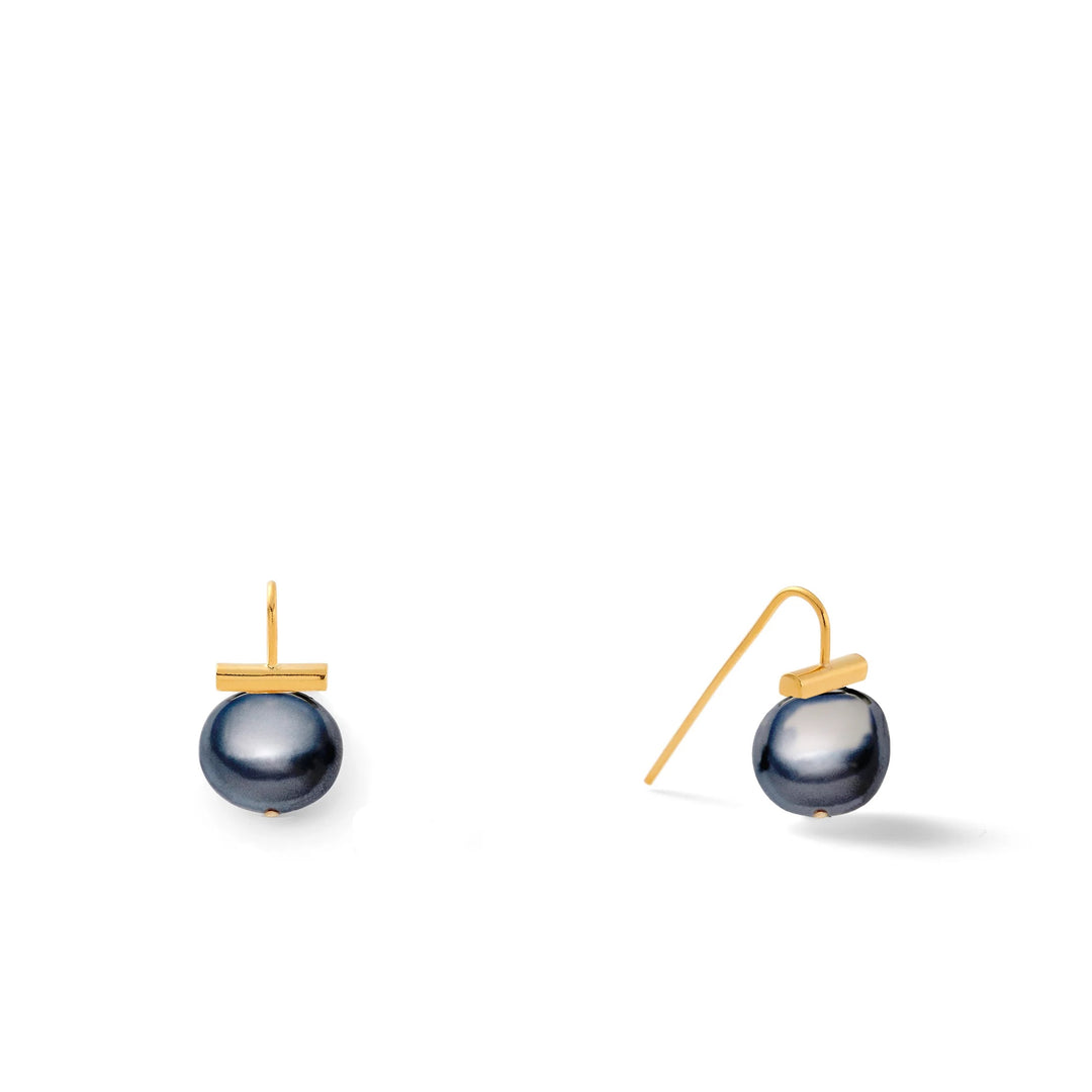 Pearl Petite Pebble earring by Catherine Canino, minimalist accessory featuring small pearl and pebble design, close-up view