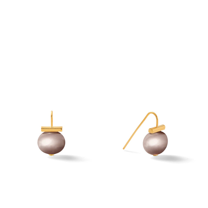 Pearl Petite Pebble earring by Catherine Canino, showcasing a small pearl-shaped accessory with a delicate pebble design.