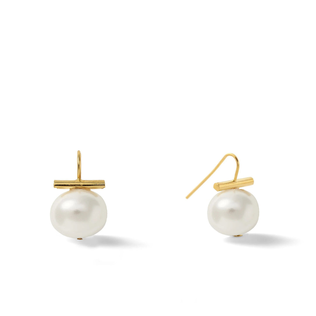 Catherine Canino Pebble Medium Pearl Earring featuring a smooth, round pearl on a delicate accessory setting.