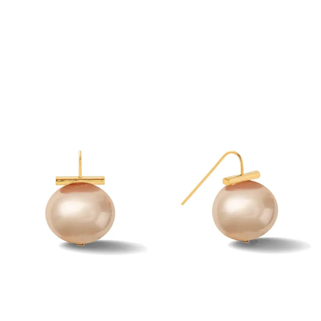 Catherine Canino Pebble Medium Pearl Earring showing a round pearl earring with a smooth surface and elegant design.