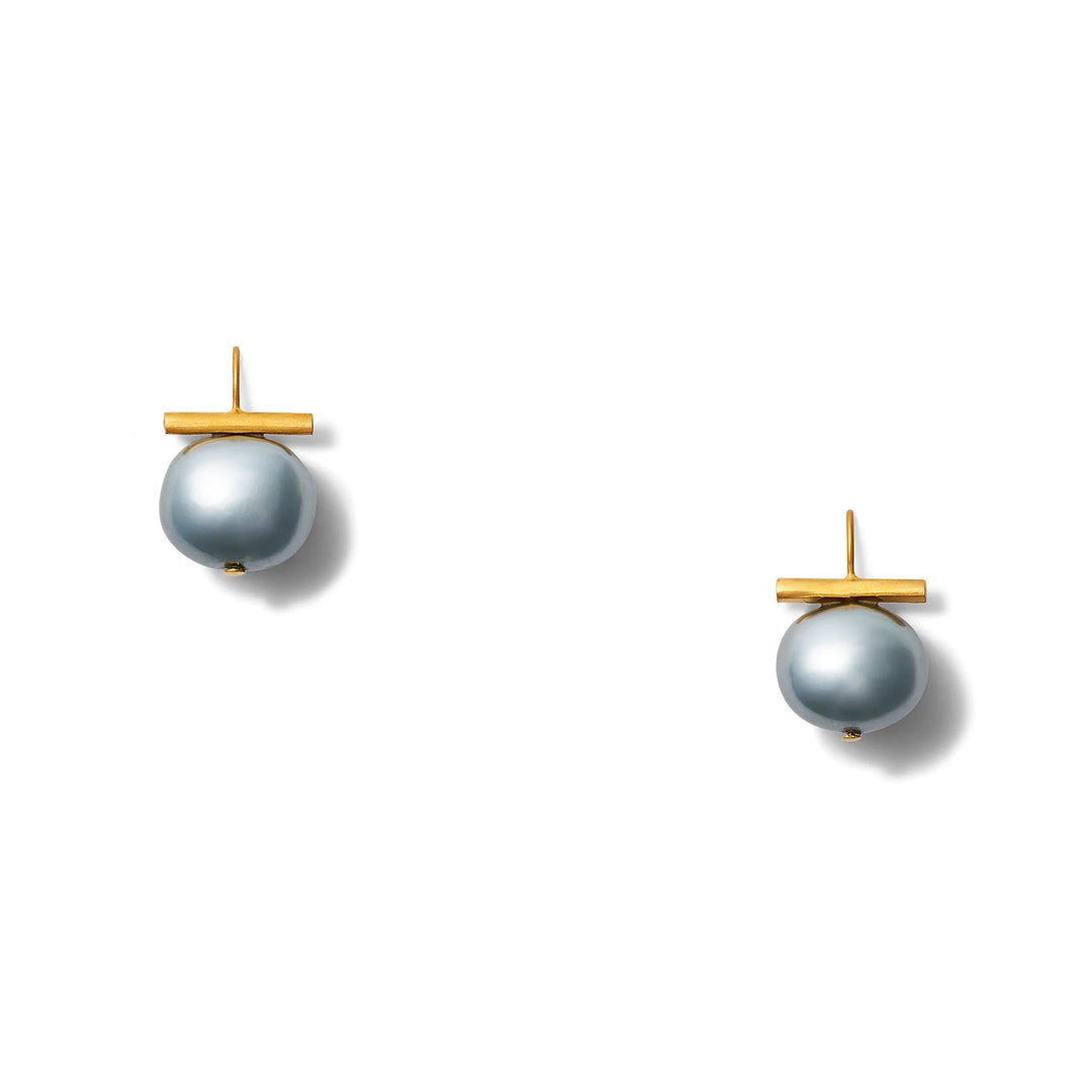 Catherine Canino Pebble Medium Pearl Earring showing a round pearl with a smooth surface and elegant design.