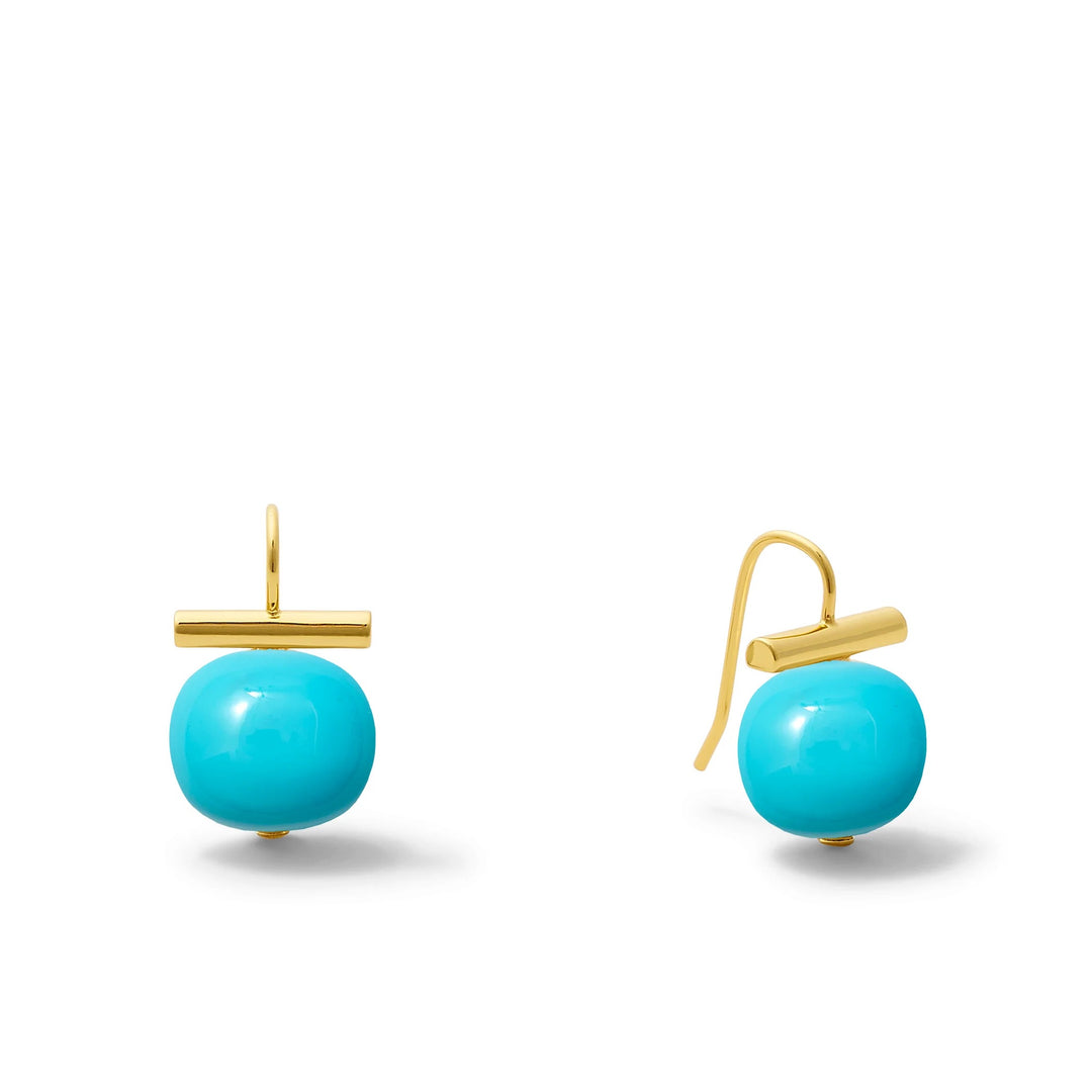 Catherine Canino Pebble Medium Pearl Earring showcasing a smooth, round pearl dangling from a delicate accessory setting.