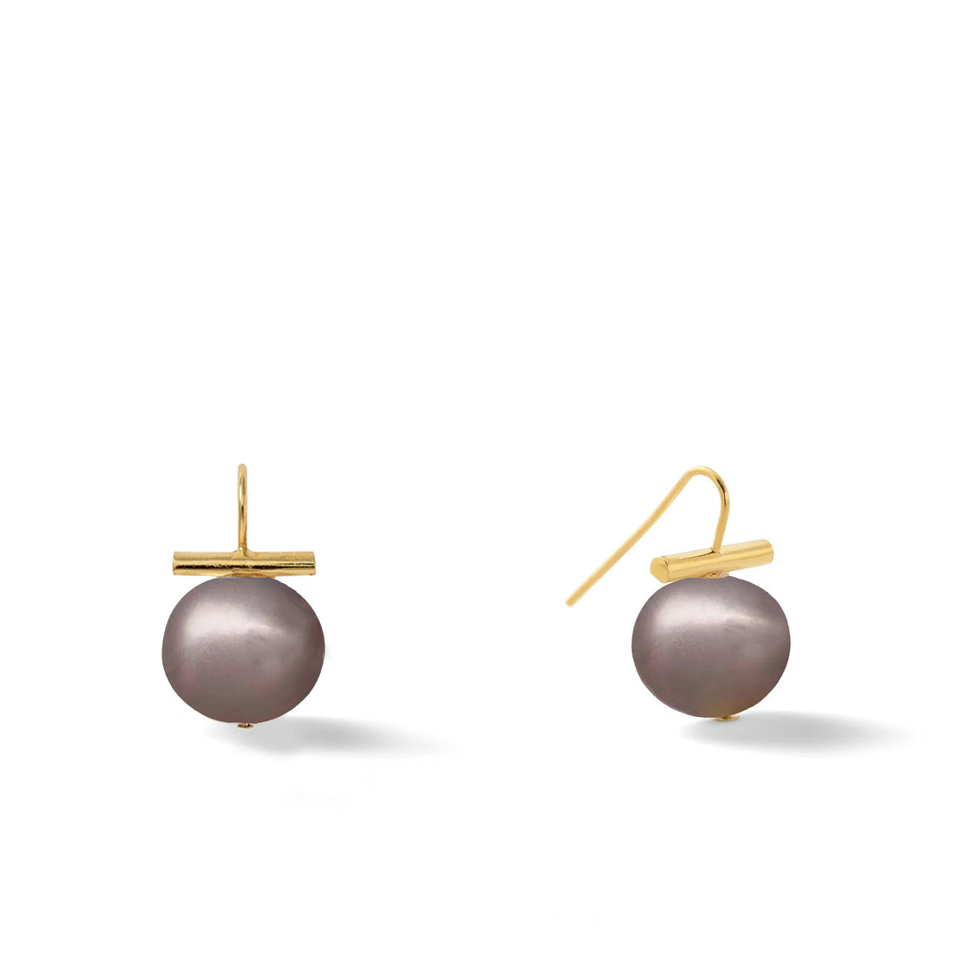 Large pearl earring from Catherine Canino's Pebble Accessories collection, featuring a smooth, round pearl design.