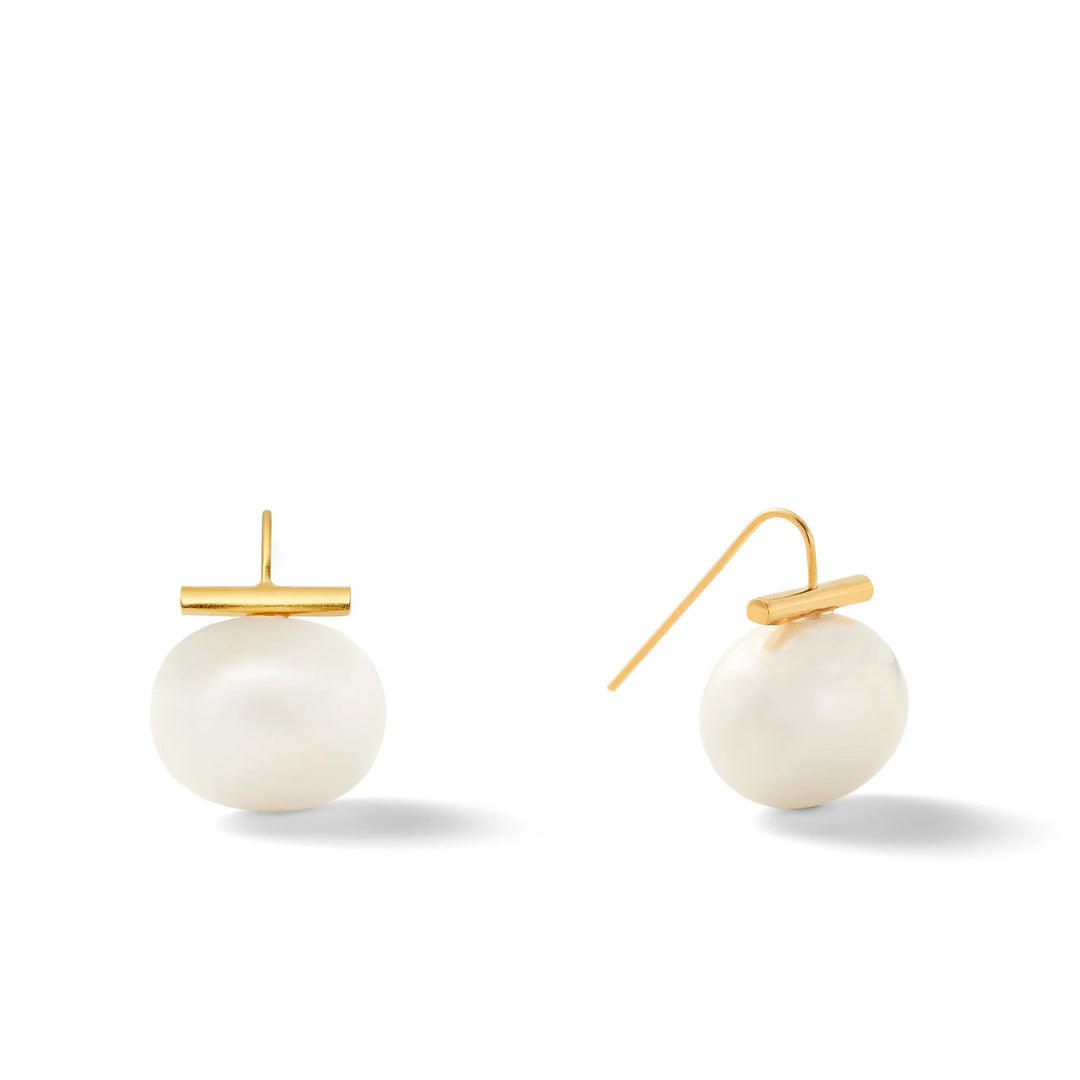 Large pearl earring from Catherine Canino featuring a smooth, rounded pearl in a stylish accessory design.