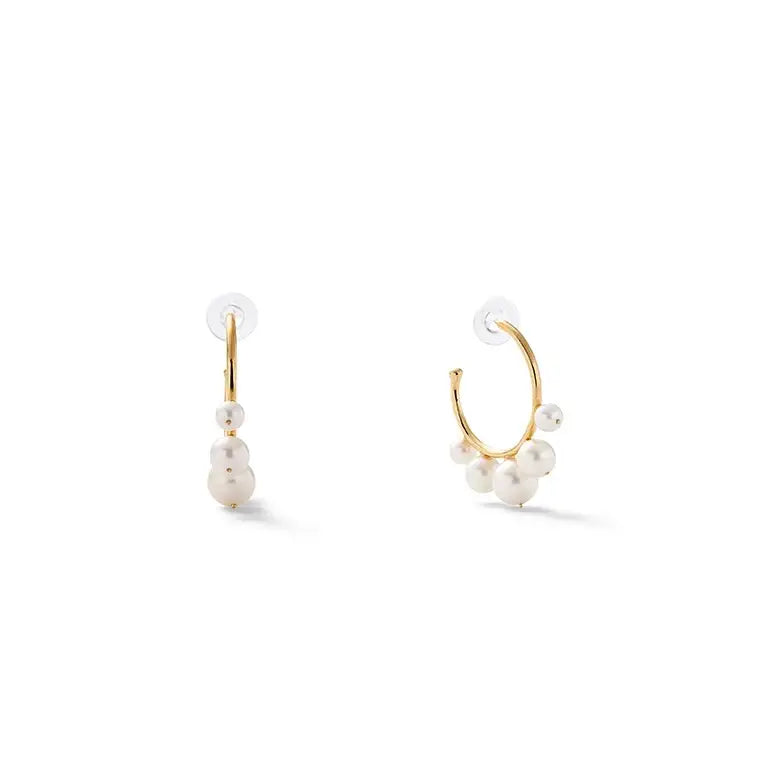 Large pearl swirl hoop earring from Catherine Canino featuring a stylish, oversized accessory with pearl accents and swirl design.
