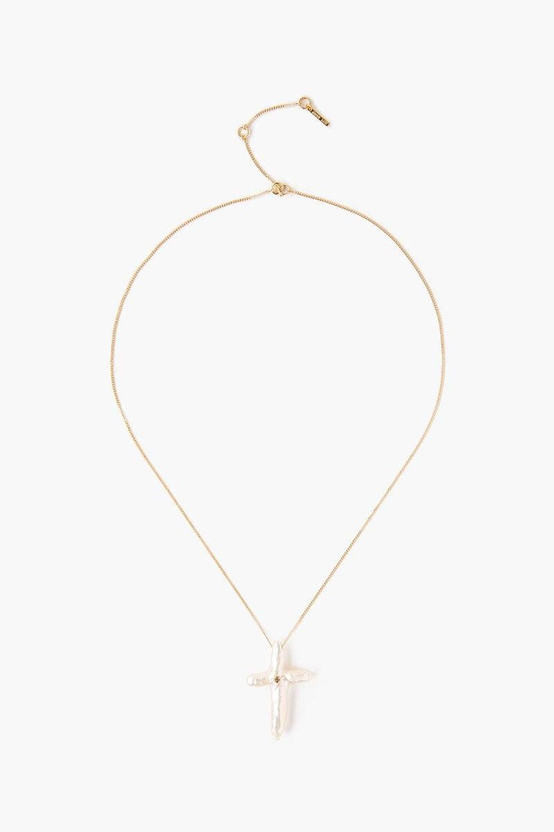 Chan Luu pearl cross with diamond necklace, elegant accessories featuring a baroque pearl cross and sparkling diamond accents.
