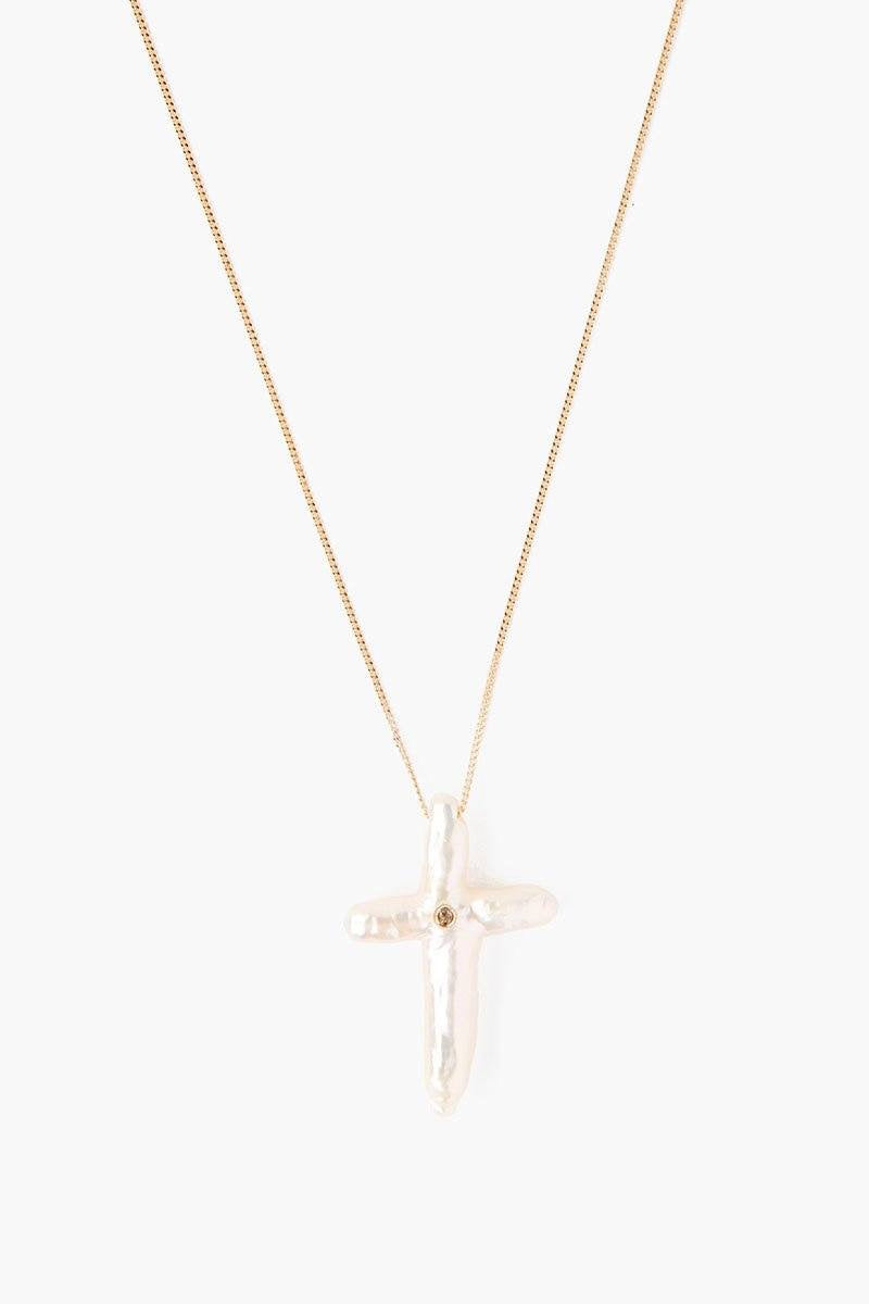 Chan Luu pearl cross with diamond necklace, elegant jewelry accessory featuring pearls, cross pendant, and sparkling diamonds.