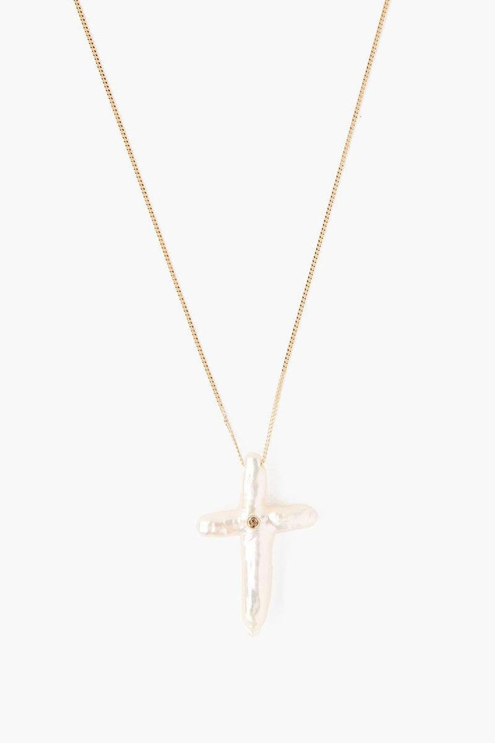 Chan Luu pearl cross with diamond necklace, elegant jewelry accessory featuring pearls, cross pendant, and sparkling diamonds.