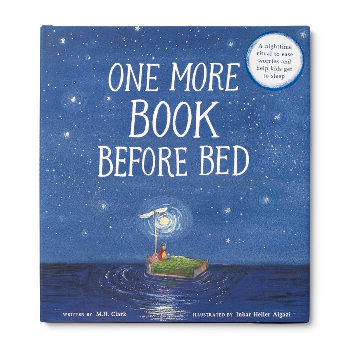 Baby reading "One More Book Before Bed" by Compendium, soft-focused image showing the children's bedtime storybook.