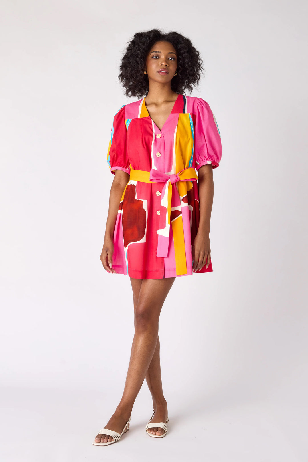Crosby by Mollie Burch Stevie Barragan dress displayed on a hanger, featuring a stylish, flowy design with vibrant patterns.