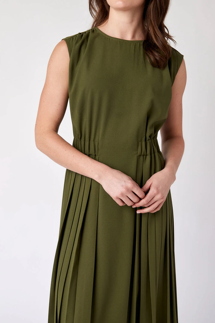 Crosby by Mollie Burch Brantley dress in a stylish, flowy design, displayed on a hanger with vibrant fabric details.