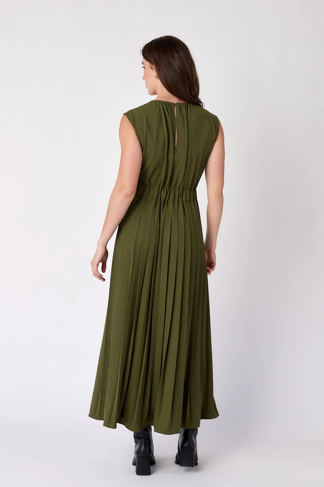 Crosby by Mollie Burch Brantley dress featuring a floral pattern and flowy silhouette, displayed on a hanger against a neutral background.