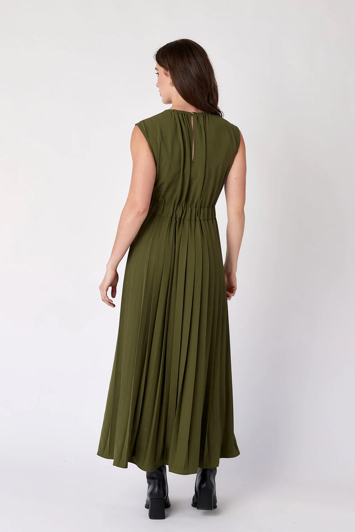 Crosby by Mollie Burch Brantley dress featuring a floral pattern and flowy silhouette, displayed on a hanger against a neutral background.