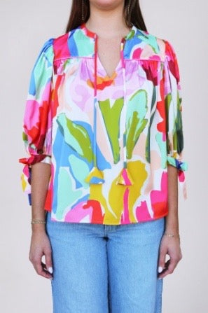 Figgy Painted Petals Crosby by Mollie Burch top featuring vibrant floral print and lightweight fabric.