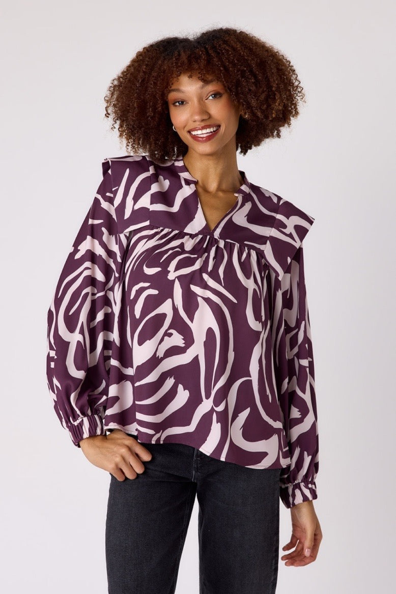 Crosby by Mollie Burch Gaines top in soft fabric, featuring a relaxed fit and stylish neckline, displayed on a hanger.