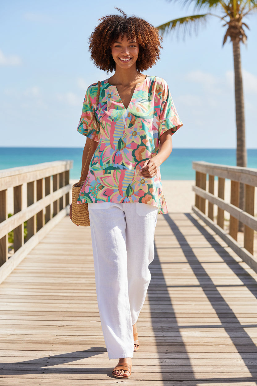 Crosby by Mollie Burch Judy Bazaar blouse, stylish top with floral pattern and ruffled details, shown in a close-up view.