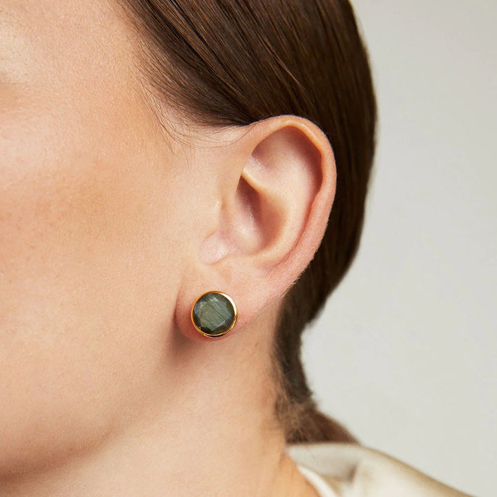 Large Signature Knockout Stud Earring from deaN Davidson, close-up of sleek, modern jewelry accessory with a bold design.