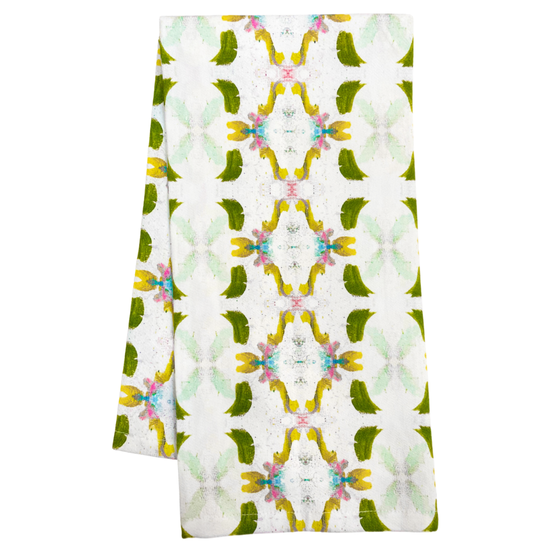 Patterned fabric with green, yellow, and white design on a white background