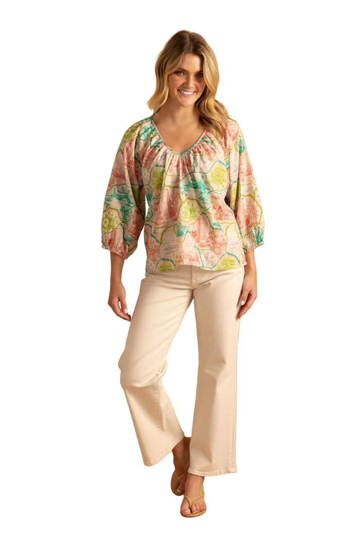 Double A Beatrice Tea Party blouse, light-colored tops with ruffle details and lace accents, displayed on a hanger.