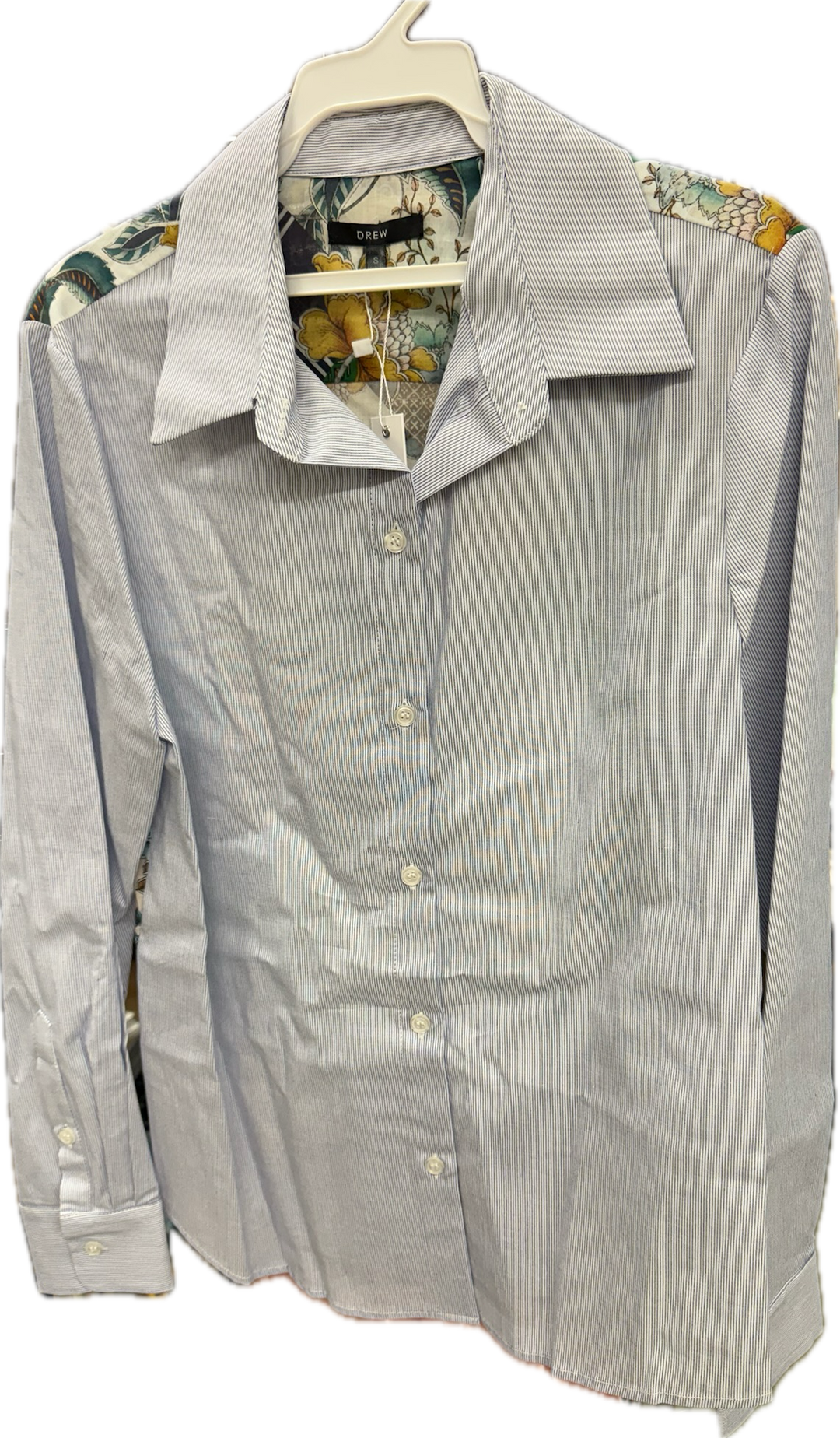 Mixed media blouse from Drew Clothing, stylish tops with a unique blend of fabrics and patterns, shown on a model.