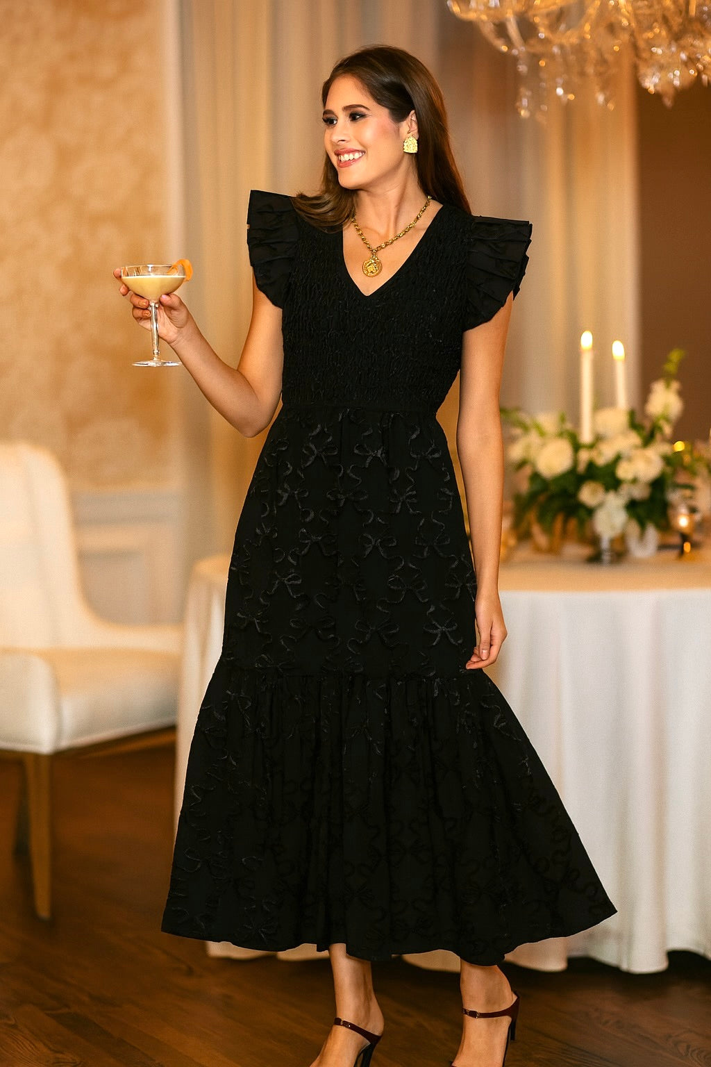 Emily McCarthy Grace Bow Lattice Midi Dress displayed on a model, featuring a bow detail and lattice pattern in a stylish midi length.
