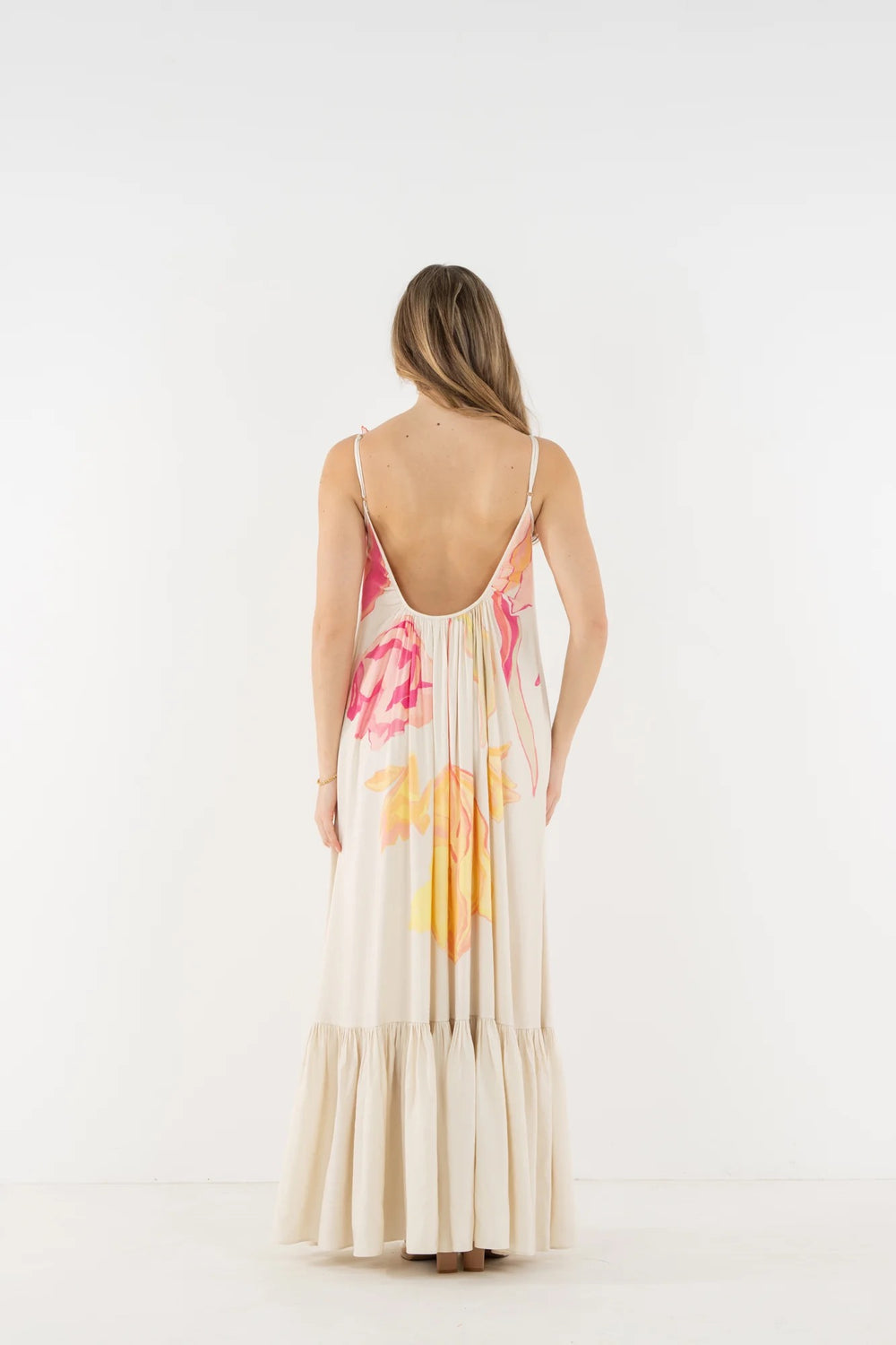 Emily McCarthy Susannah Linen Maxi Dress shown flowing, sleeveless design with a relaxed fit and floral pattern on lightweight linen fabric.