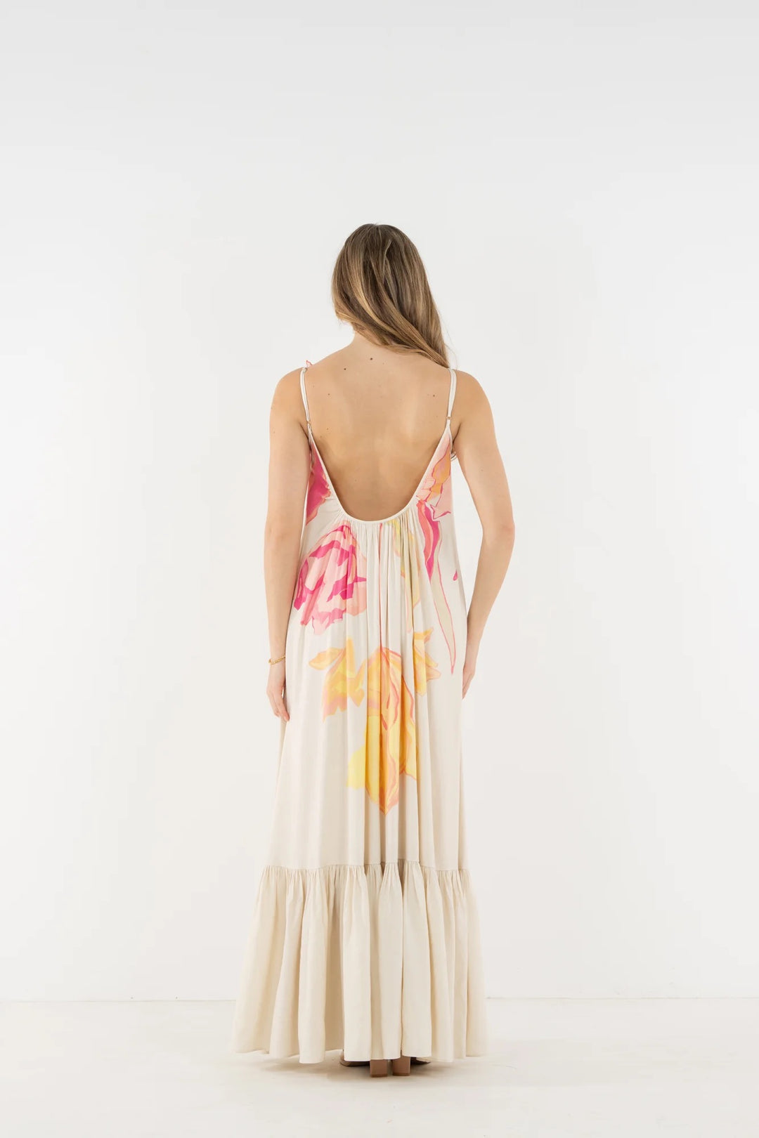 Emily McCarthy Susannah Linen Maxi Dress shown flowing, sleeveless design with a relaxed fit and floral pattern on lightweight linen fabric.
