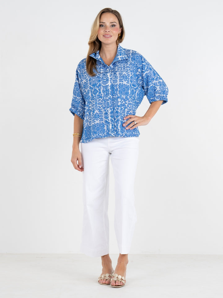 Emily McCarthy Bonny Positano top showcased in a stylish tops collection, featuring a vibrant, patterned fabric with a flattering fit.