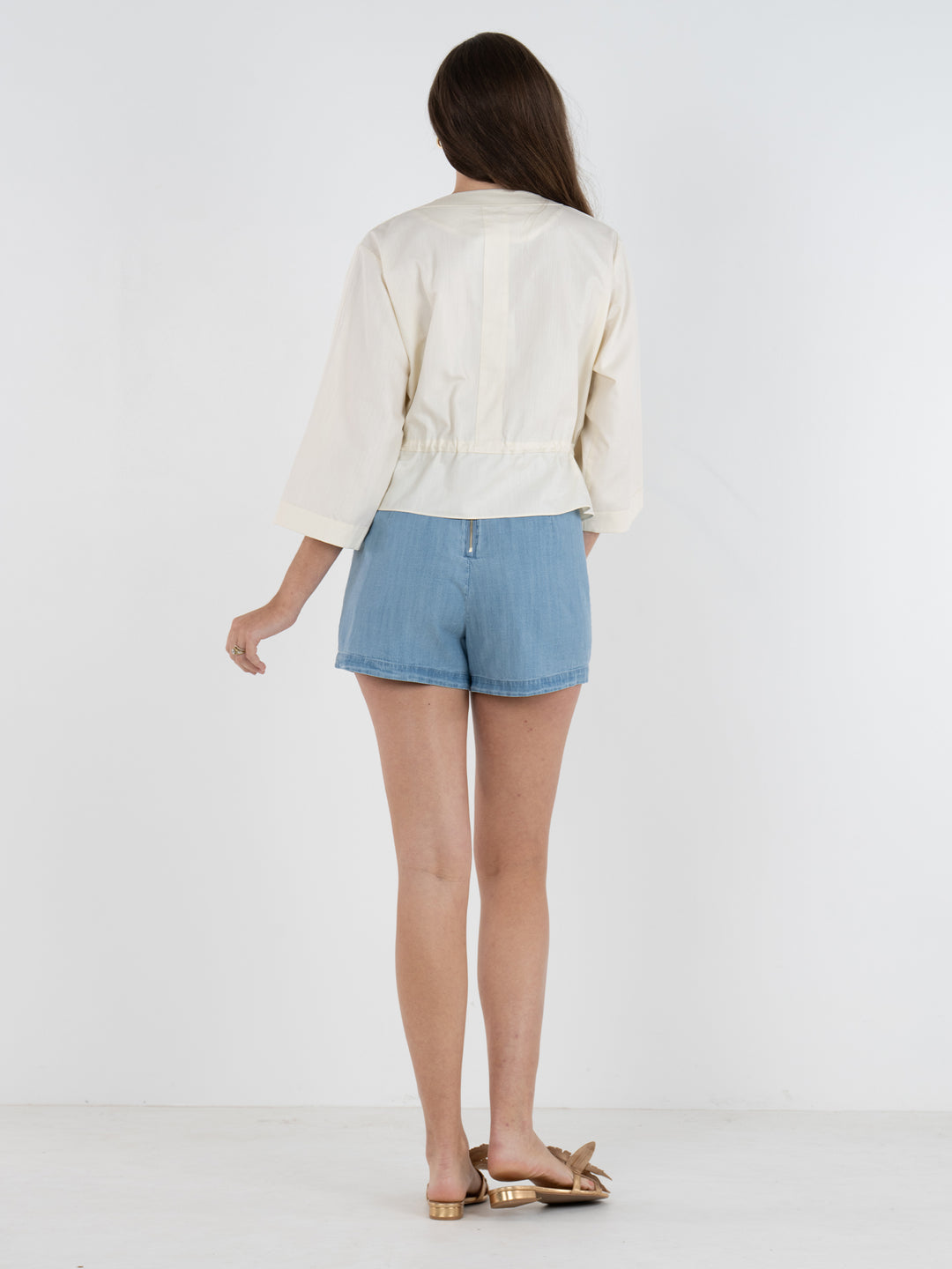 Emily McCarthy Sandshell Bailey Bomber top in neutral fabric, featuring a relaxed fit and stylish collar detail.
