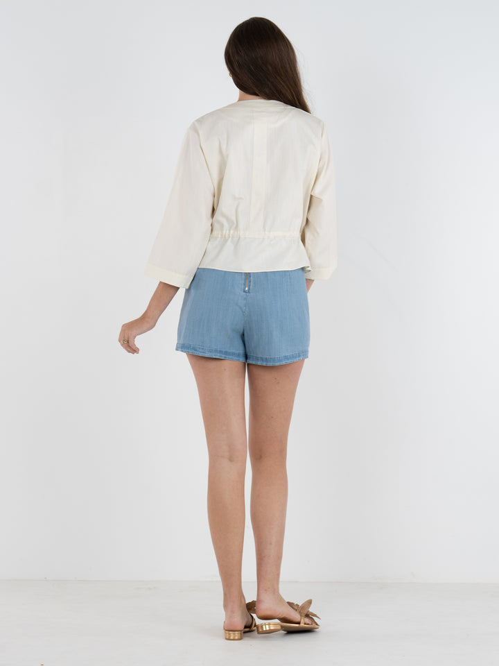 Emily McCarthy Sandshell Bailey Bomber top in neutral fabric, featuring a relaxed fit and stylish collar detail.