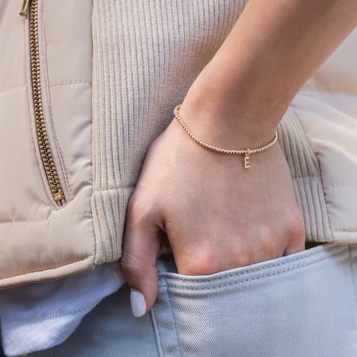 Enewton Classic Gold 2mm Bead Respect Initial Gold Bracelet with small gold beads and initial charm, stylish accessory for men and women.