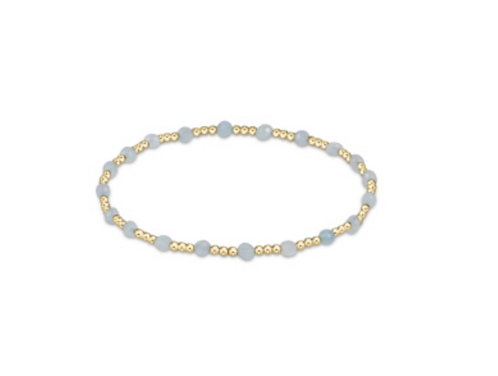 Enewton gemstone gold sincerity pattern 3mm bead bracelet with gold accents, showcasing a delicate and elegant accessory design.