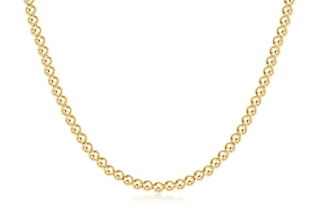 15-inch gold beaded choker necklace with 4mm beads from Enewton, showcasing a sleek, classic jewelry accessory.