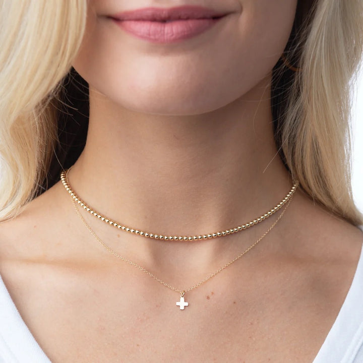 Enewton 17-inch gold choker necklace with 3mm bead design, close-up of the classic jewelry accessory on a plain background.