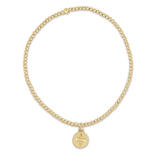 Enewton classic 2mm gold bead bracelet with a direction gold disc, featuring delicate gold beads and a stylish disc charm.
