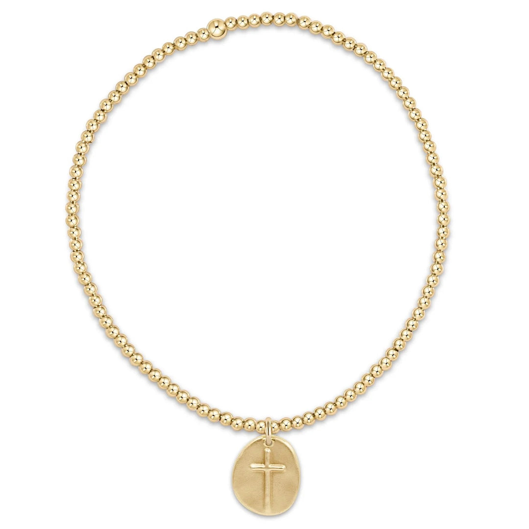 Enewton Classic Gold 2MM Bead Bracelet with small gold charm, showcasing a delicate gold jewelry accessory with beaded design.