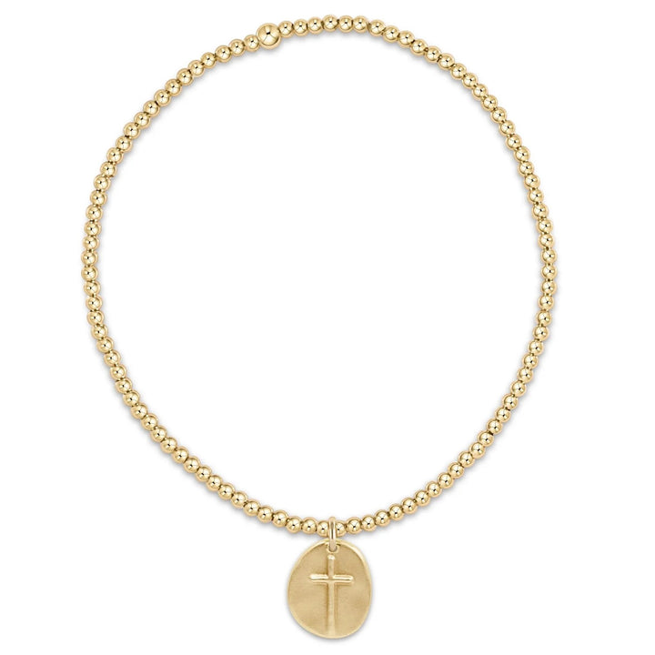 Enewton Classic Gold 2MM Bead Bracelet with small gold charm, showcasing a delicate gold jewelry accessory with beaded design.