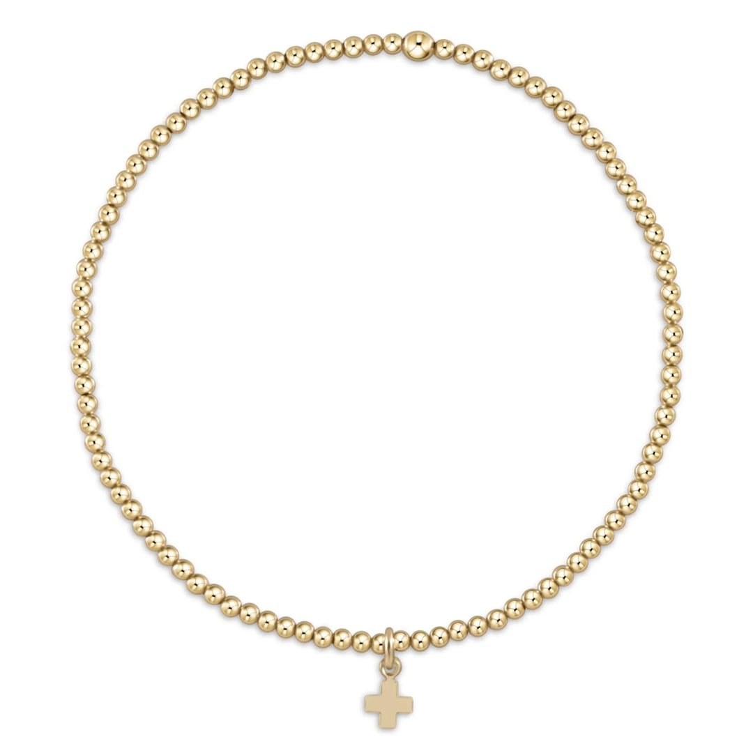 Enewton classic gold 2mm bead bracelet with signature cross small gold charm, stylish accessories for everyday wear