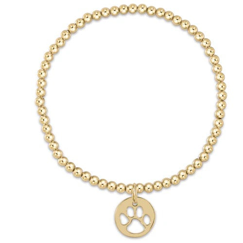 Enewton gold bead bracelet with 3mm beads and a paw print disc charm, showcasing a stylish accessory design.