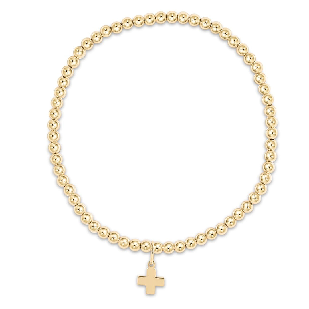 Enewton Classic Gold 3mm Bead Bracelet with signature cross gold charm, featuring elegant gold beads and detailed cross pendant.