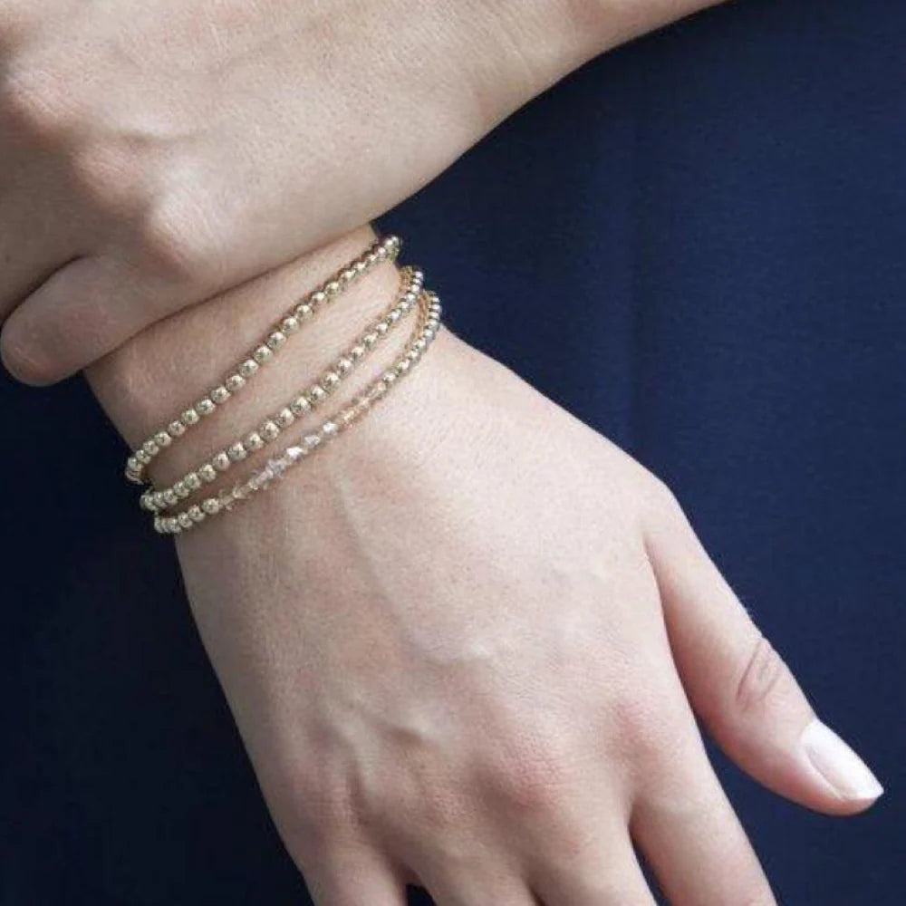 Enewton Classic Gold 4mm bead bracelet with gold-toned beads, stylish accessories for everyday wear and elegant occasions.